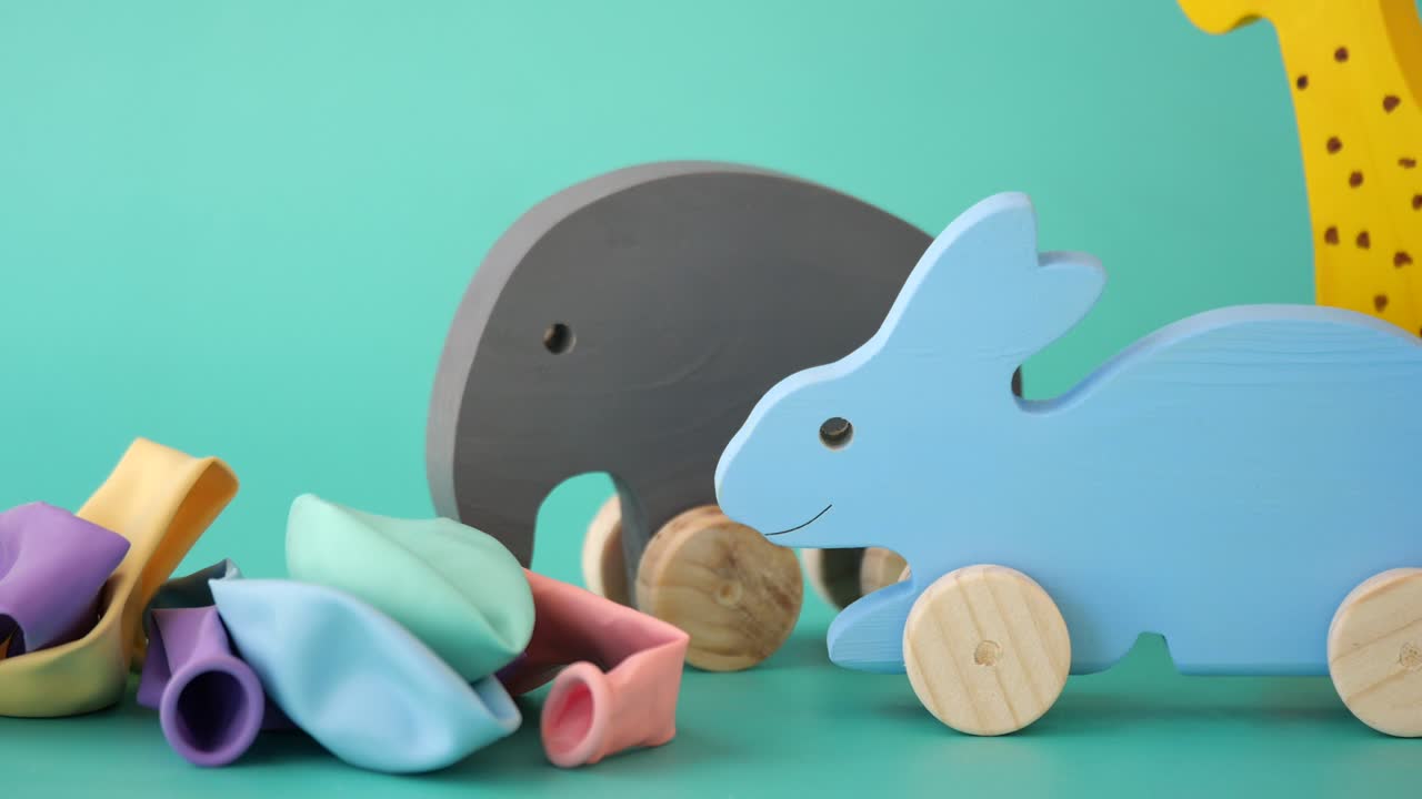 Colorful Wooden Animal Toys and Balloons