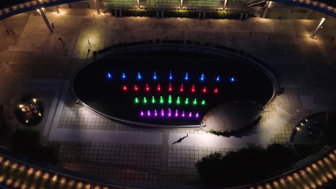 Night View of Modern Urban Plaza with Fountain and Walking Path