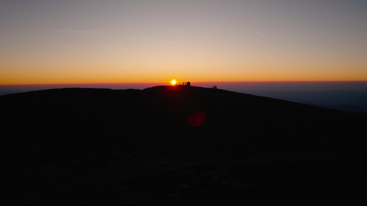 From the serene embrace of dawn to the mesmerizing hues of sunset, a visual journey over Austria's majestic peaks and valleys, where the orange light transforms the scenery into a surreal dreamscape