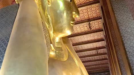 giant golden buddha statue in a thai temple