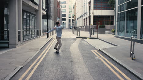 contemporary funky caucasian businessman street dancer dancing freestyle in the city