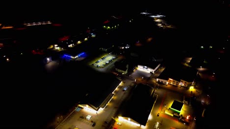 Nighttime-Aerial-View-of-Urban-Landscape-with-Glowing-City-Lights