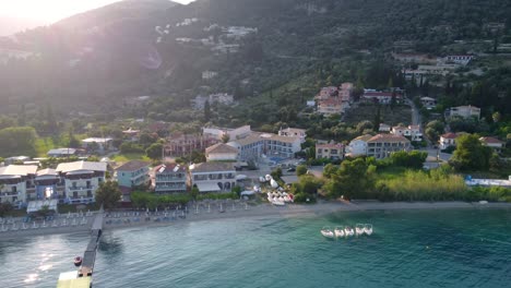 Sandy-Beach-and-Cityscape-of-Nidri-at-Lefkada-Island,-Greece---Aerial