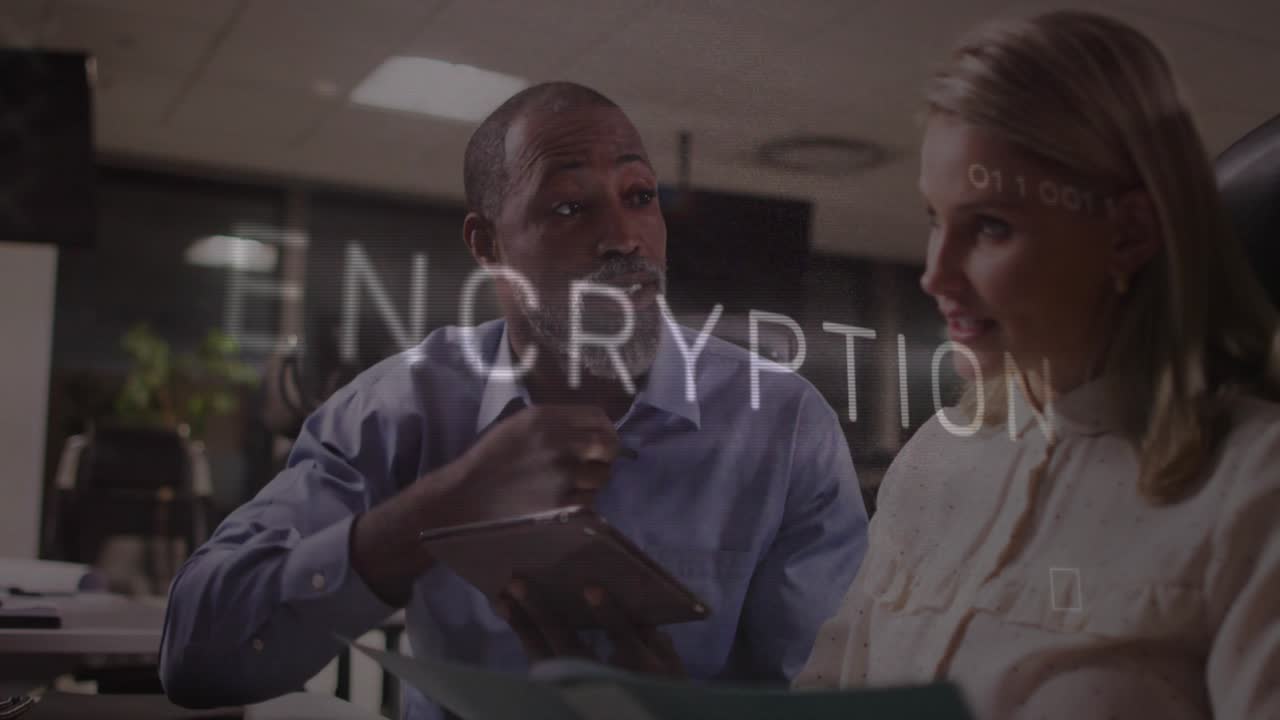Man tapping tablet screen and showing encryption letters for encryption demo as woman listens
