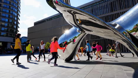 city plaza with children and modern sculpture