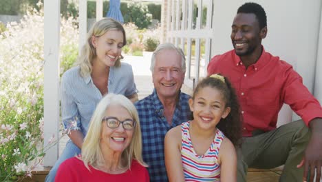 video of diverse family spending time together outside