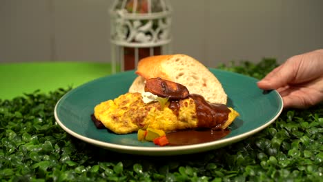 waitress-deliver-omelette-in-garden-leaf-table-slow-motion-tortilla-española