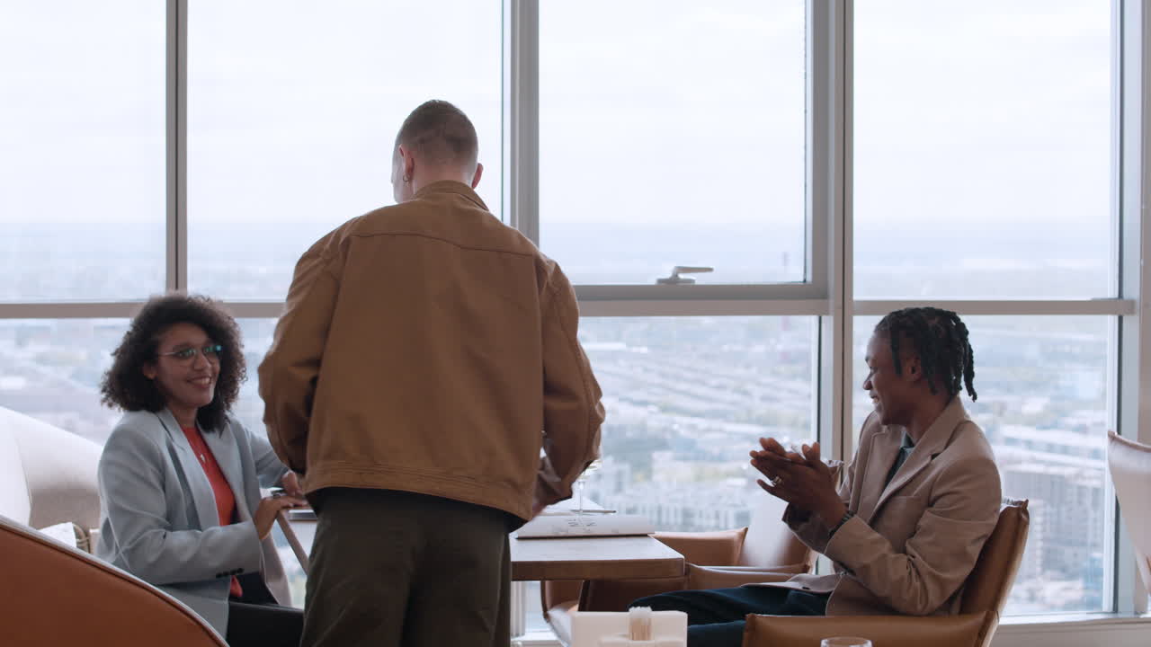 Friends Celebrating Lunch with City View