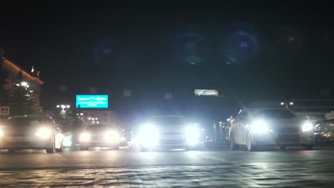 city street at night with cars