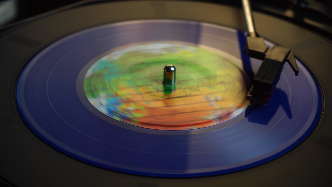 Finishing Playback of Blue 45 RPM Vinyl Record on Automatic Turntable, Stopping Rotation, Close Up