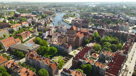 aerial panorama of old town in gdansk, flying over church of sts