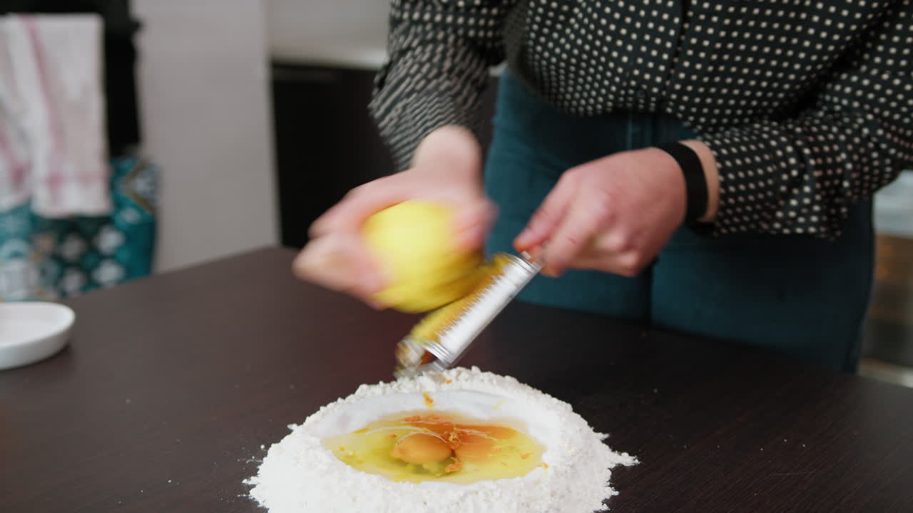 Woman Grates Lemon Zest For A Typical Calabrese Dessert
