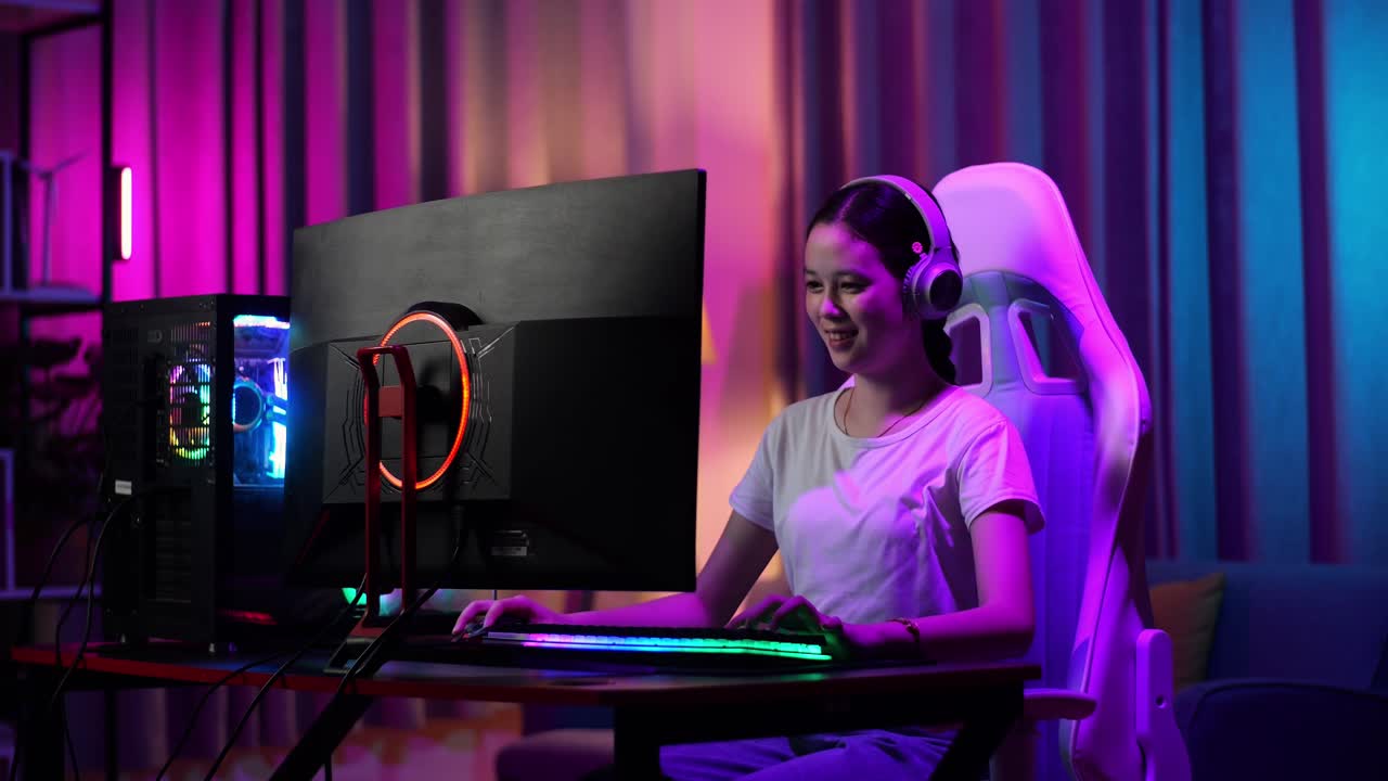 Excited Asian Teen Girl Gamer Playing Video Game On Computer