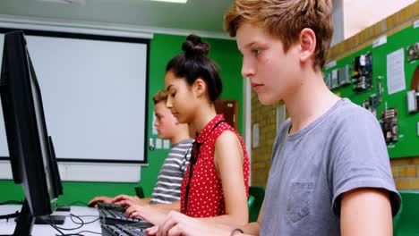 Students-studying-on-computer-in-classroom