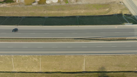 Driving-cars-on-suburb-highway-during-sunny-day-in-Poland