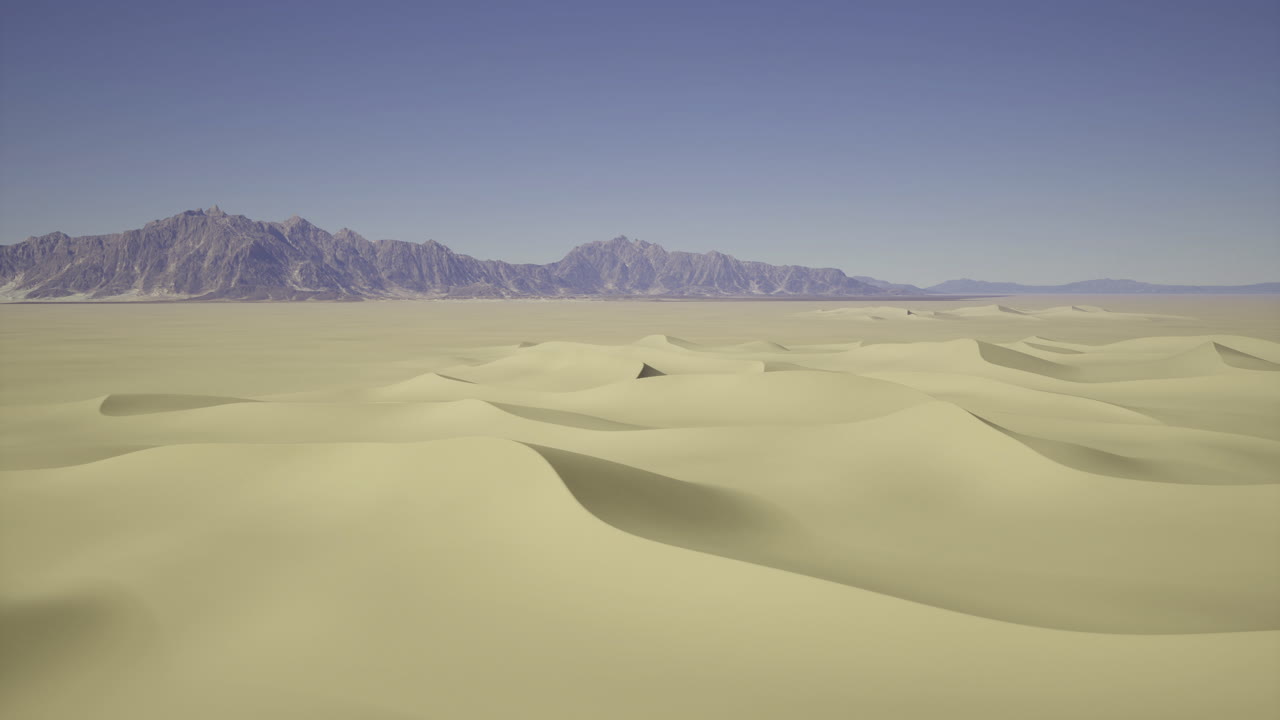 Expansive desert landscape with distant mountains under clear blue sky