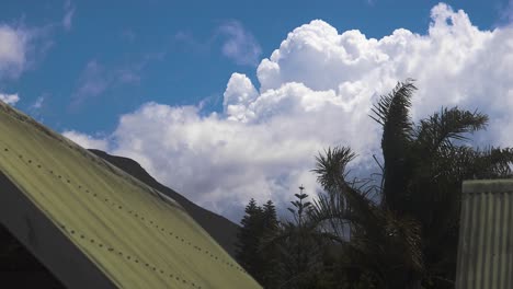 time lapse of huge white cumulonimbus clouds changing form in the wind