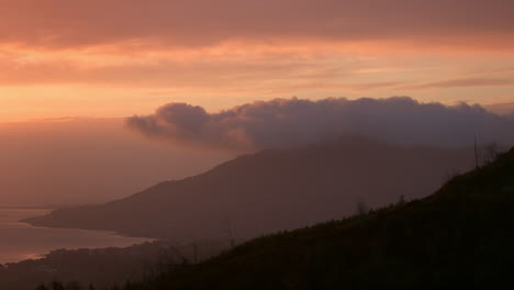 Blue-And-Pink-Sunrise,-Sunset-Clouds,-with-Mountains-and-Sea