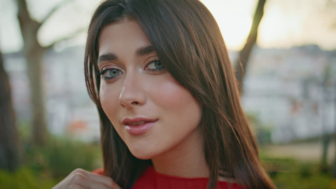 Model posing garden looking camera closeup. Woman enjoying nature