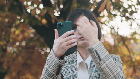 stylish woman using a smartphone outdoor.