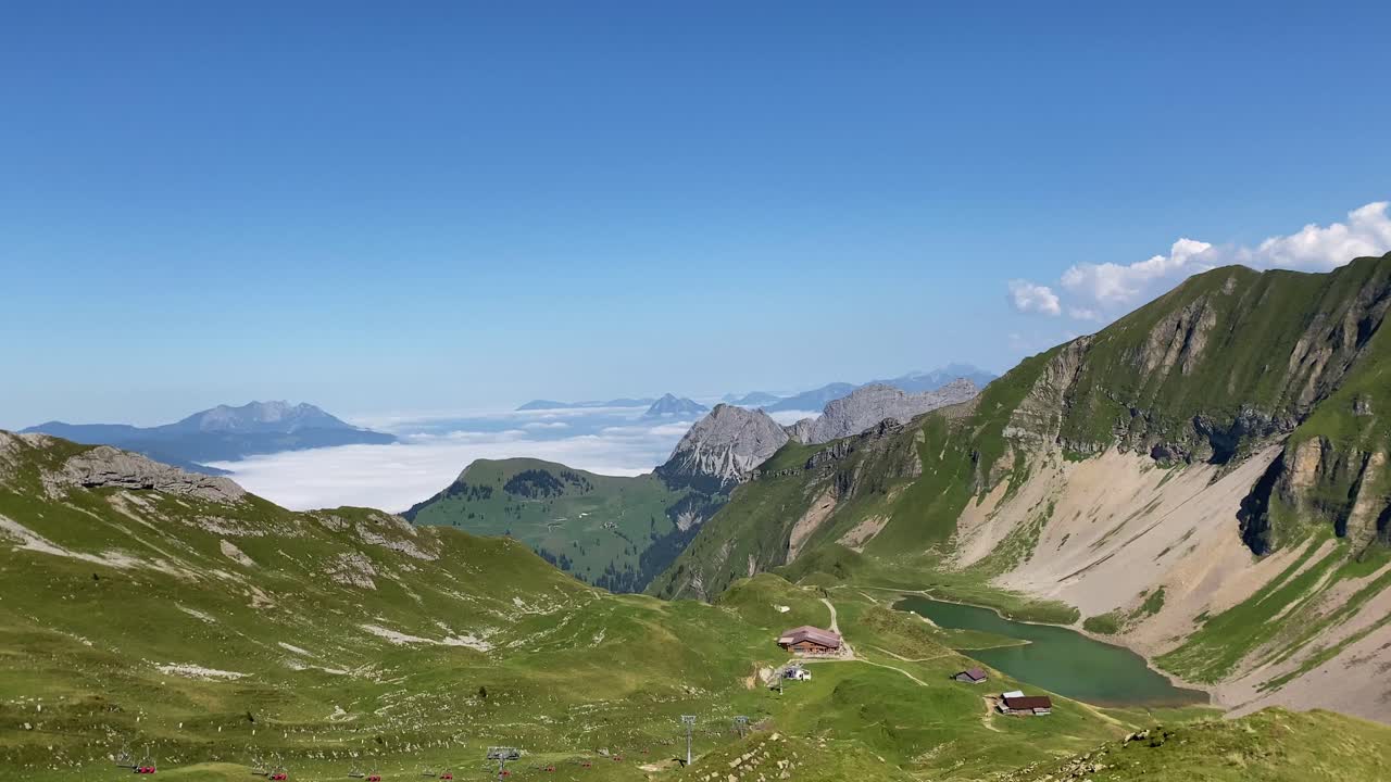 Sunlit clouds in Swiss Alps pass, panorama from Eiseesattel, Rothorn trekking trail
