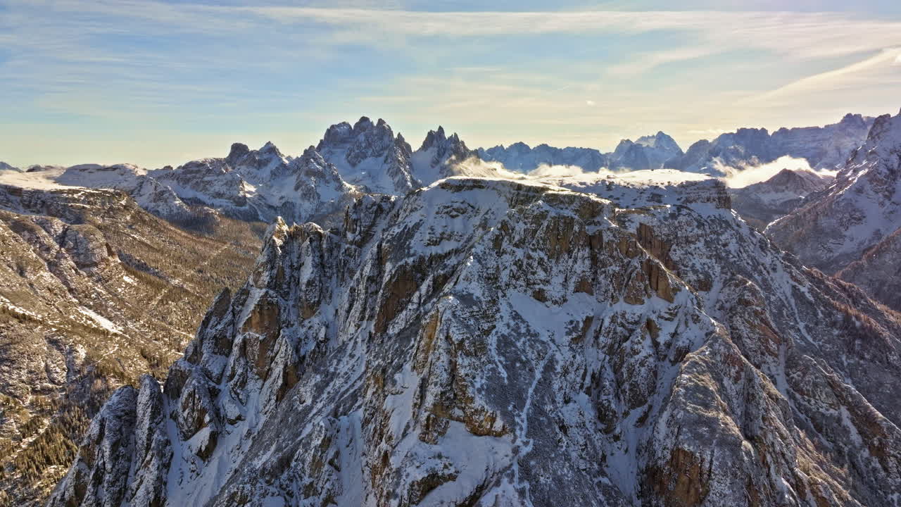 Aerial drone view of snow on the mountains in the Dolomites, Italy