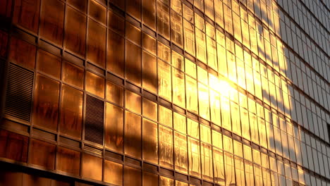 golden walls of glass and steel doth the sun's rays cast their reflection