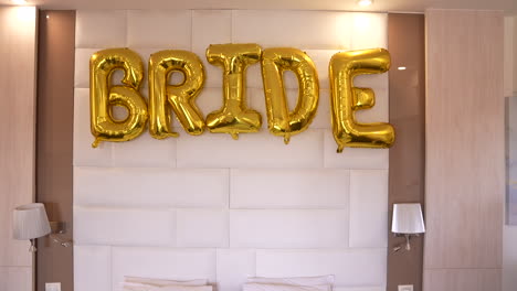 decorations and golden balloons for the bride's room