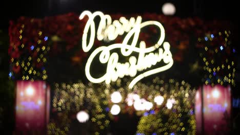 defocus merry christmas background in colorful blinking light