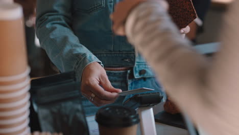 beautiful woman paying using credit card transaction service buying coffee in cafe spending money at restaurant