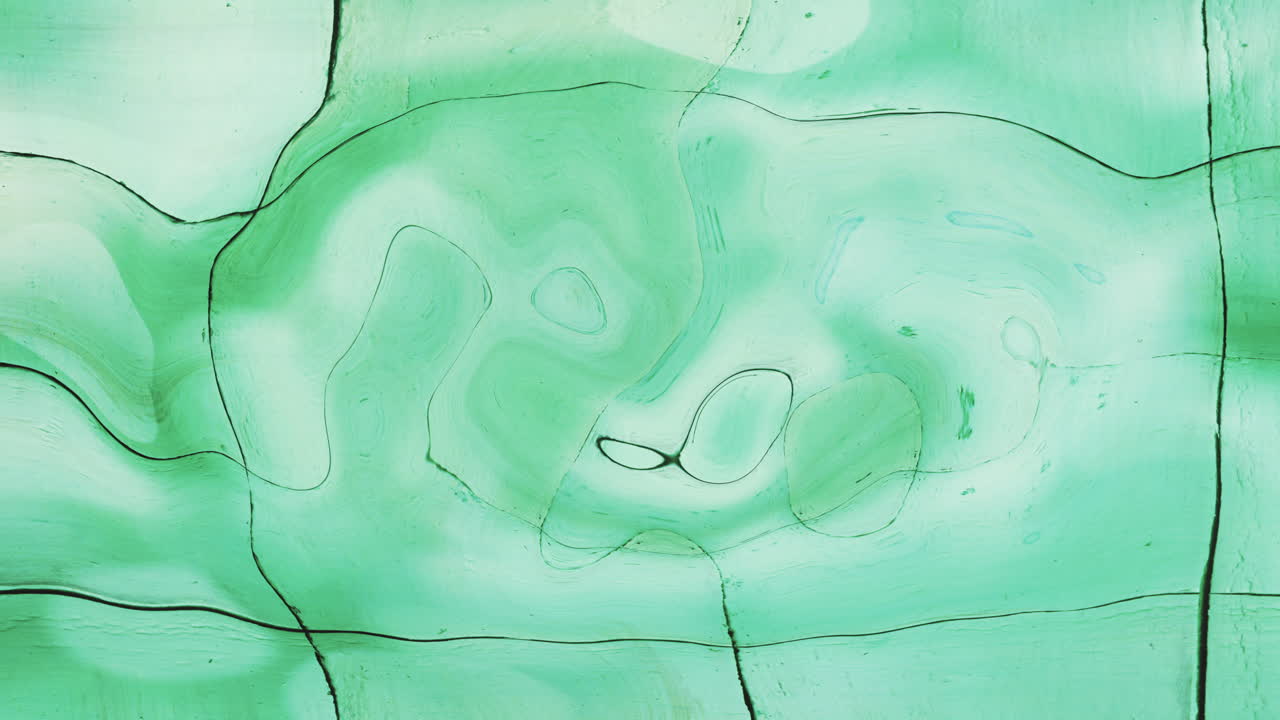 Animación digital de un efecto de textura líquida fluida sobre fondo verde