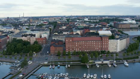 downward aerial view of cars passing along helsinki waterfront at dusk, finland