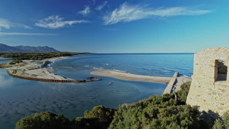 aerial view of corsican water reservoir surrounded by lush trees