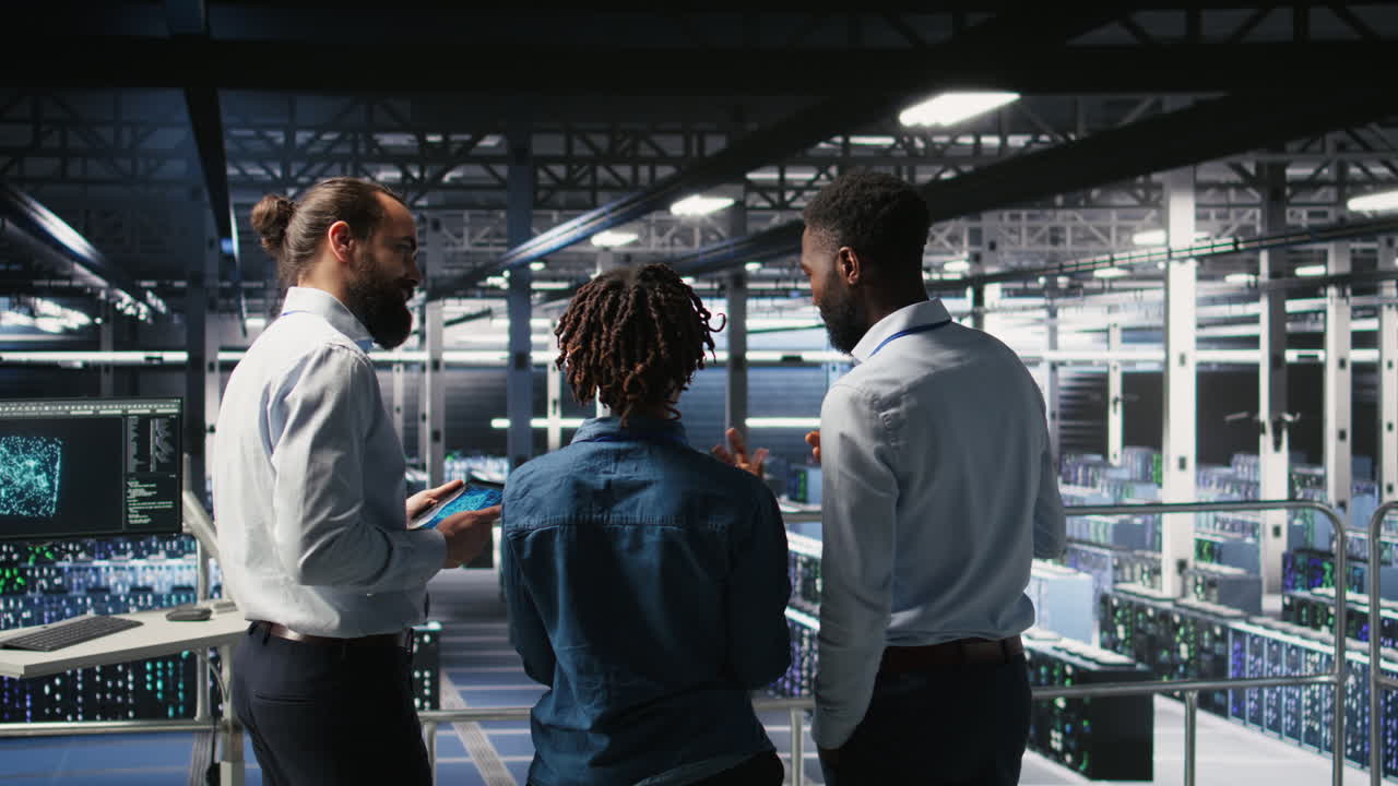 Data center manager talking with workers doing maintenance on AI supercomputers