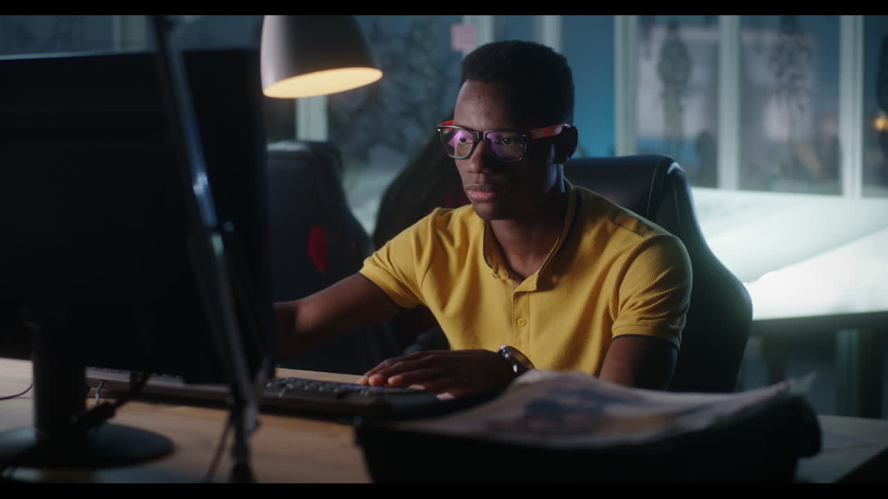 Man working on computer at night