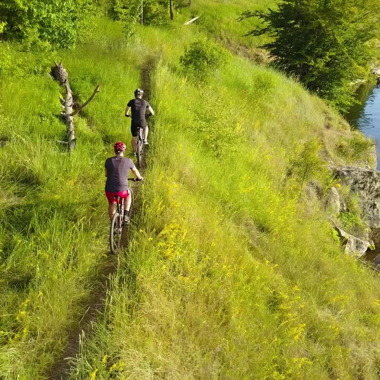 Men Cycling On A Rural Road