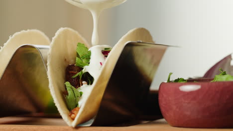 delicious tacos with creamy sauce