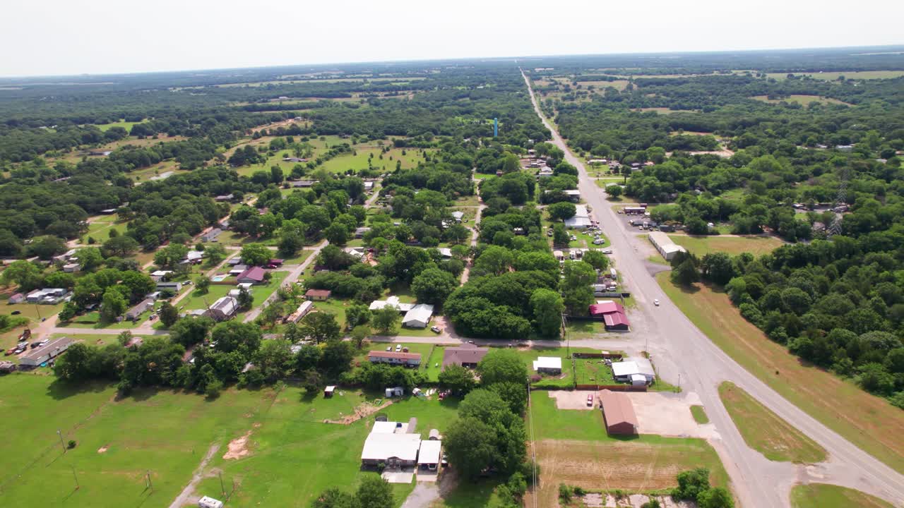 Aerial footage of the town of Cartwright in Oklahoma. Camera turns in a point of interest style clockwise