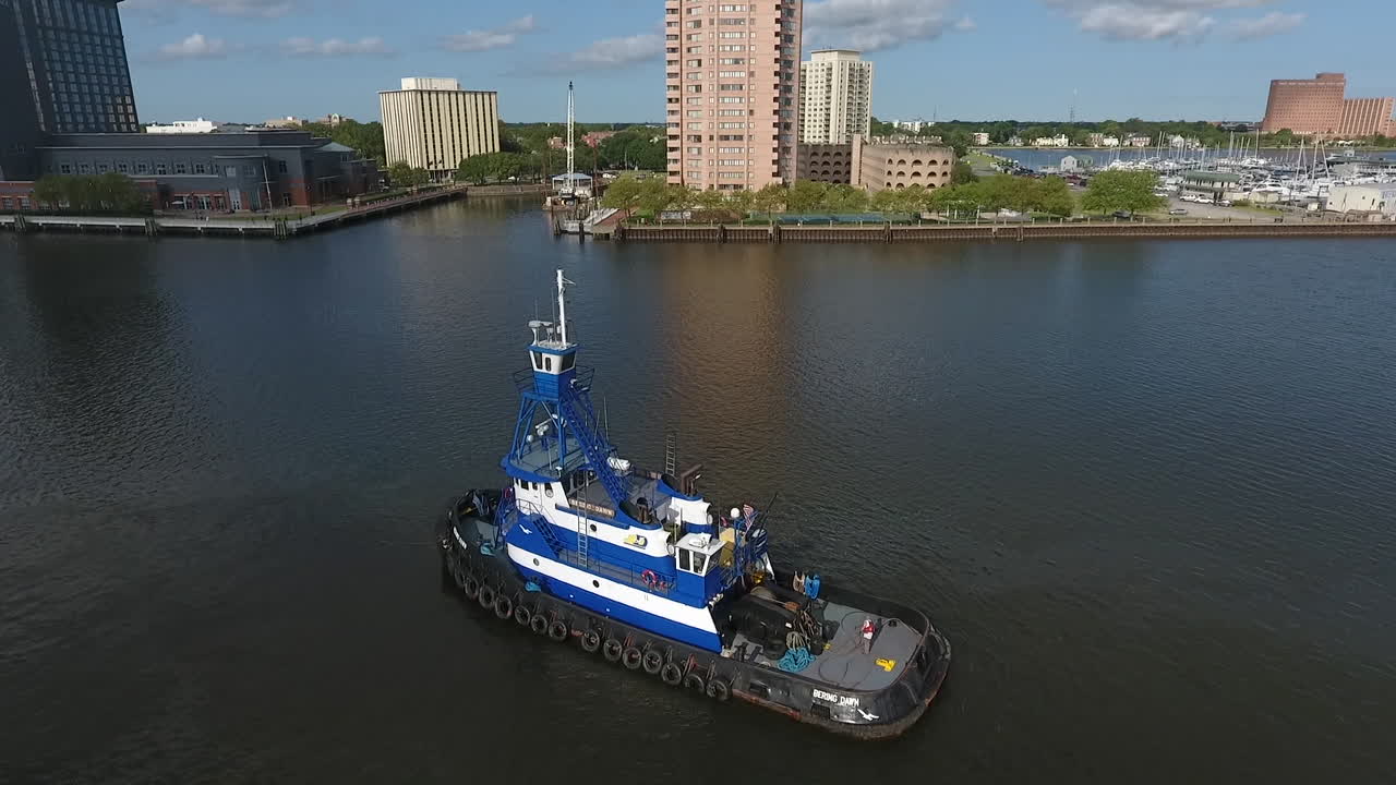 blue boat on water daytime