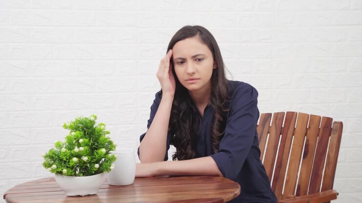 Stressed Indian girl at a cafe