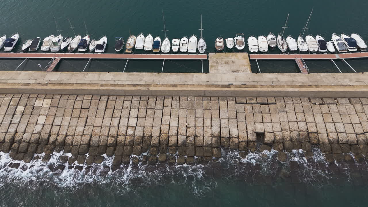 Flyover reveals marina geometry with crisp blue water and sunny clear sky