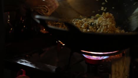 awesome slow motion shot of a street vendor cooking their indonesian food