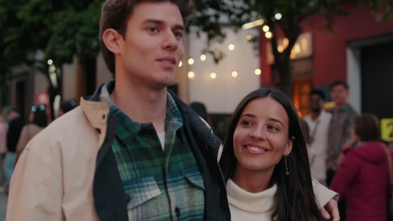 Couple Strolling Through Seville at Night