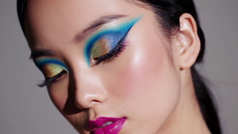 vibrant and artistic eye makeup with fuchsia lips close-up