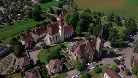 aerial view circling over the traditional churches of interlaken in switzerland