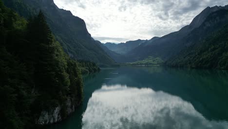 picture perfect natural beauty of mountain ranges and cloudy sunset horizon with lake