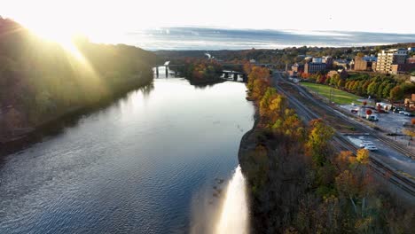 beautiful sunrise reflects in river during autumn fall foliage