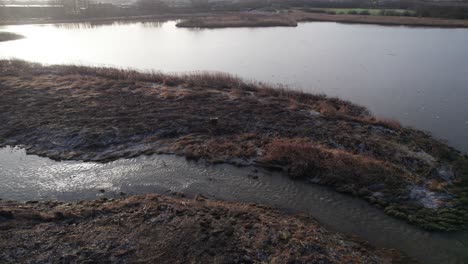 Overview-of-Creek-Running-From-Lake-in-Denmark---Truck-Shot-and-Panning-Shot