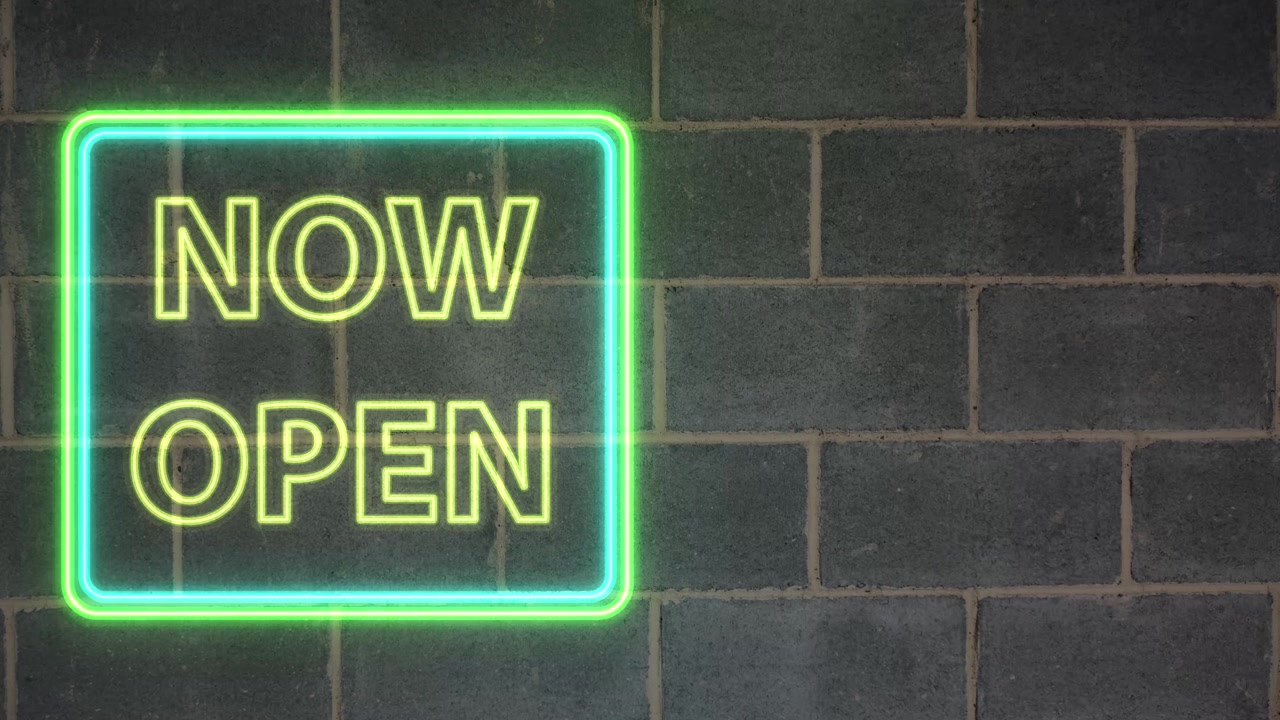 Animated green neon sign flashes Now Open text against a dark textured brick background.