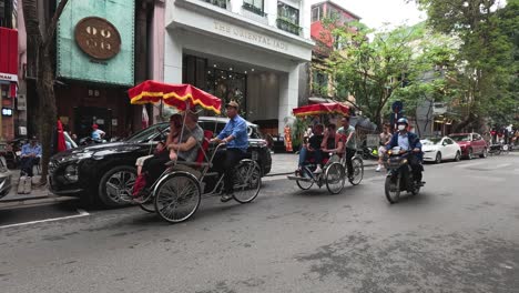 pedestrians and vehicles moving on a busy street